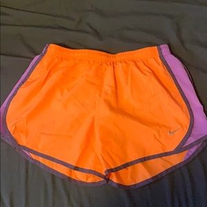 orange and purple nike shorts